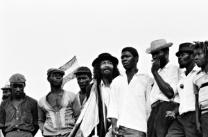 Jamaican rude boys await the arrival ofHaile Selassie