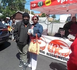 Peetah at new album sign "Strictly Roots" pose with happy fan Paulette "