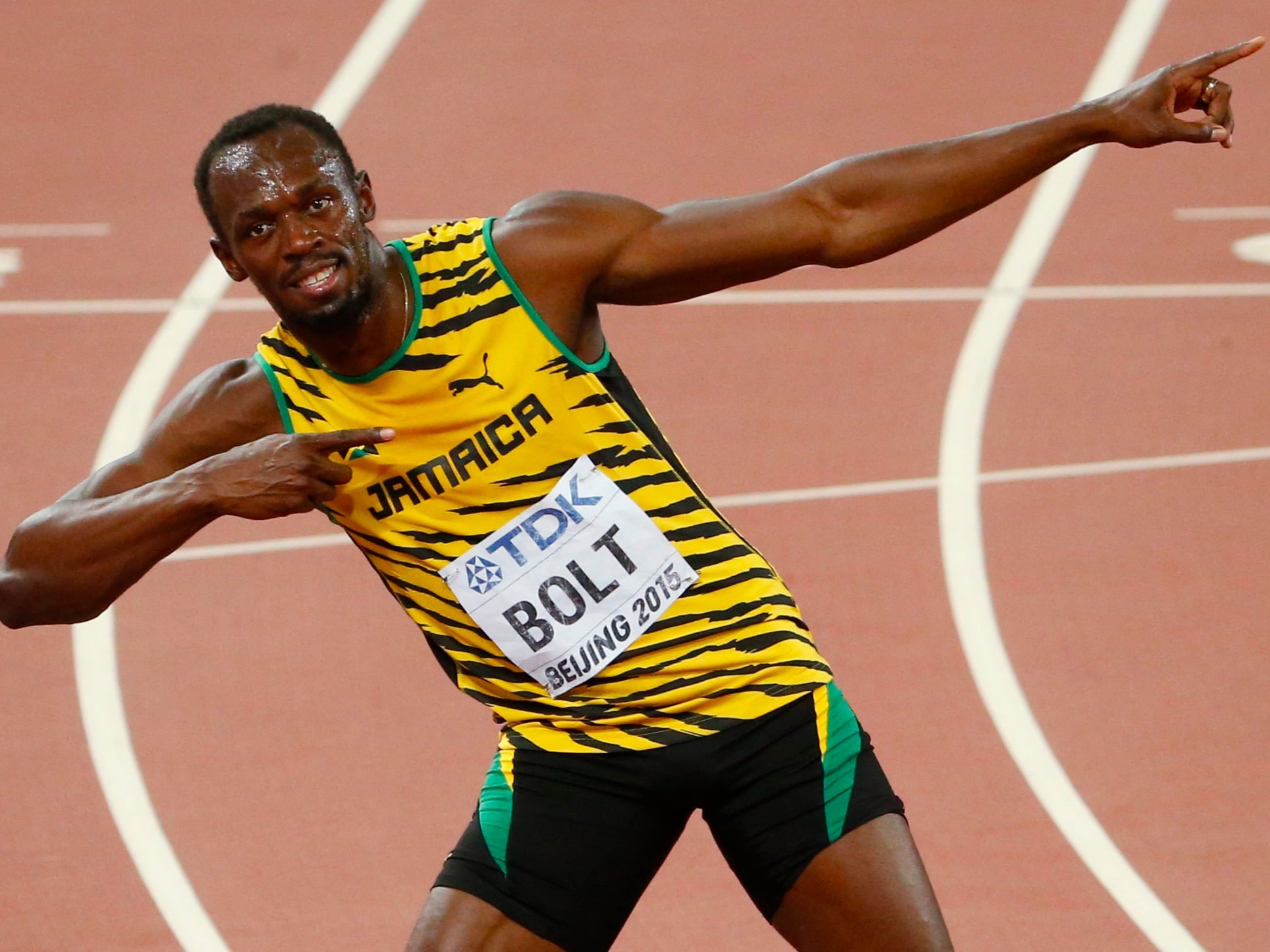 Usain Bolt 100m Olympic Victory go into his famous Lighting Bolt pose.