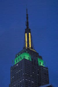 The Empire State Building in NYC on August 6th in the color of the Jamaican Flag