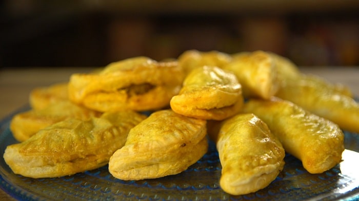 a plate full of jamaican beef patties