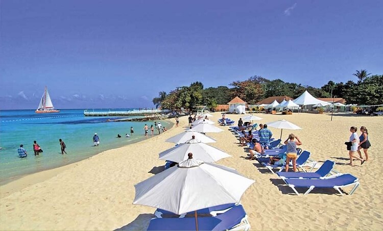 people sunbathing at Cornwall Beach, Jamaica