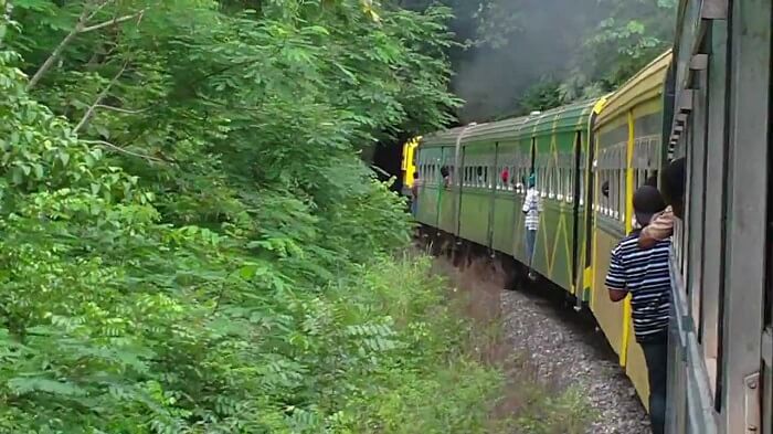 People riding a train in Jamaica