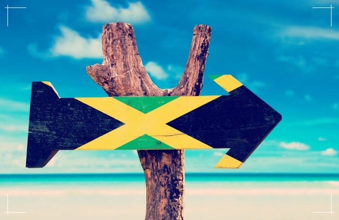 jamaica flag wooden sign on beach
