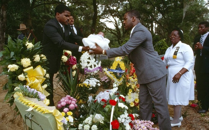 Passing a child over grave, Jamaican funeral traditions